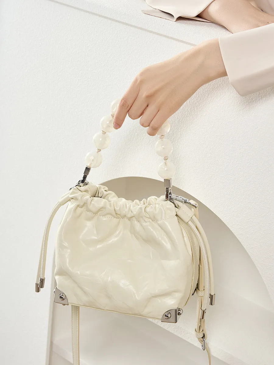 Grace Resin Handle Crossbody Beaded Bucket Bag | Leather Clutch with Floral Pleats